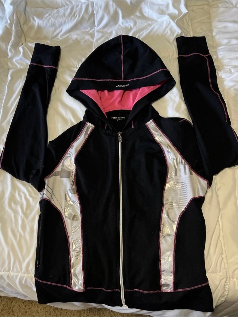 Bebe Y2K zip-up hoodie, black with pink hood lining and silver accent detailing.